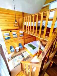 an overhead view of a room with a bedroom at Villa Celyn Dieng cabin in Diyeng