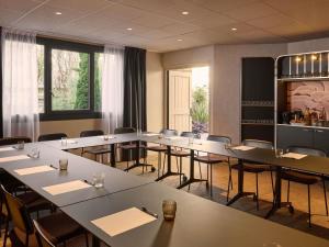 a conference room with tables and chairs in it at You Hotel de France Valence - Handwritten Collection in Valence