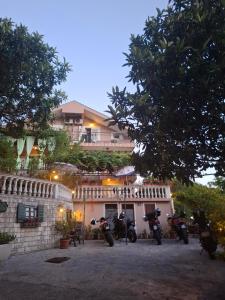 a group of motorcycles parked in front of a building at Apartmani Paulino in Herceg-Novi