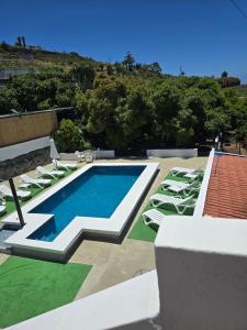 a swimming pool on the roof of a house at Casa Punta del Sol Vista Al Atlántico in Tijarafe