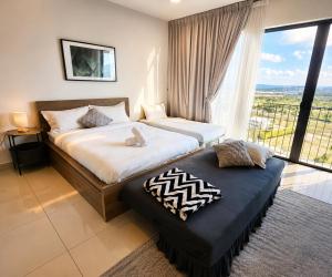 a bedroom with two beds and a large window at Minimalist Studio Trefoil Setia Alam linked bridge to Mall and Convention Centre near to NIH Peninsula in Setia Alam