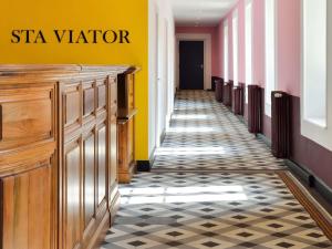 a hallway with a star water sign on the wall at Jules César Hotel & Spa Arles - MGallery Collection in Arles