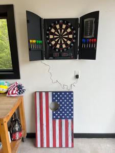 a dart board on the wall with an american flag at Flint Ridge in Sister Bay