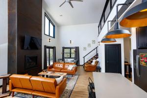 a living room with couches and a table at Flint Ridge in Sister Bay