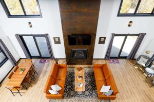 an overhead view of a living room with orange furniture at Flint Ridge in Sister Bay +35 photos