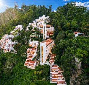 an aerial view of a building on a mountain at Sterling Yercaud in Yercaud