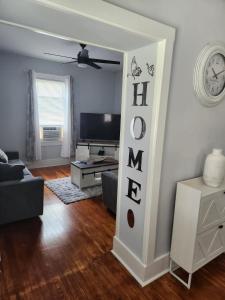 a living room with a couch and a tv at Peabody short term rental in Staunton