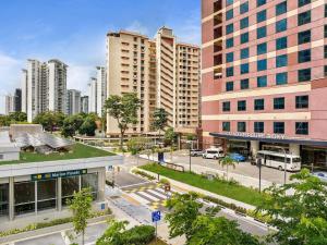 an aerial view of a city with tall buildings at Grand Mercure Singapore Roxy in Singapore