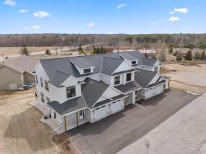 an aerial view of a large house with a driveway at La Dolce Vita in Egg Harbor