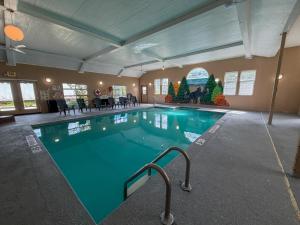 a large swimming pool in a large room at Manistique Sands in Manistique