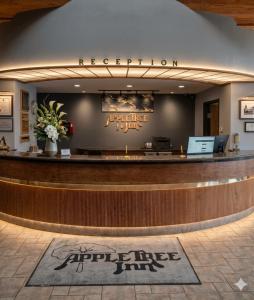 a lobby of a hotel with a reception counter at Apple Tree Inn in Independence +43 photos