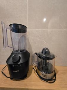 a blender sitting on top of a wooden table at Villa Fireflies in Darmasaba