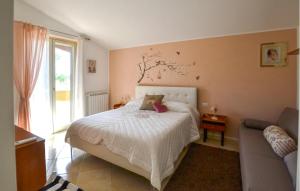 a bedroom with a bed and a couch at Beautiful Home In Arezzo in Arezzo