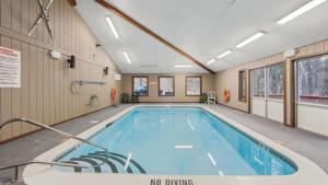 a swimming pool in a building with a no diving sign at Arena by AvantStay in North Creek