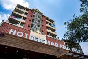 a hotel sign on top of a building at Hotel Gharana Tree in Gaya