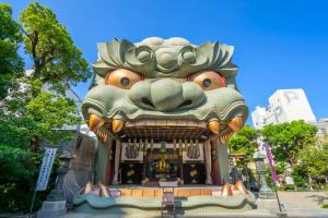a giant statue of a dragon in a park at Nipponbashi Crystal Hotel in Osaka