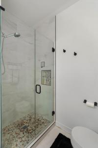 a shower with a glass door in a bathroom at Modern House in Seattle in Seattle +39 photos