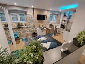 a large living room with a stone wall at Apartman Barocco Lovran in Lovran