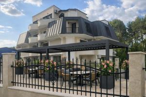 a restaurant under a canopy in front of a building at Raya Boutique in Sunny Beach