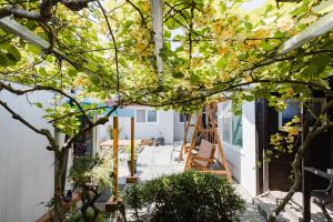 a house being remodeled with a ladder at Pyeonanhan Guesthouse in Hamdŏng-ni