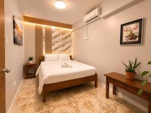 a bedroom with a bed in a room at Aloha Ocean View Resort in Pandan
