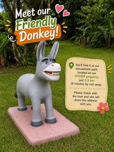 a toy donkey is on a display in the grass at Forest Garden House in Monteverde Costa Rica