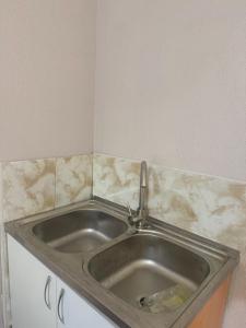 a stainless steel sink in a kitchen at Guest house at the Lake Sevan in Sevan