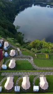 an aerial view of a resort with a body of water at Telaga Menjer Glamping 2 in Kejajar