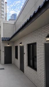 a brick building with two garage doors on it at Busan Seomyeon Nestly Hotel in Busan