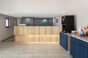 a lobby of a dental office with a counter and refrigerator at Days Inn by Wyndham Clanton AL in Clanton
