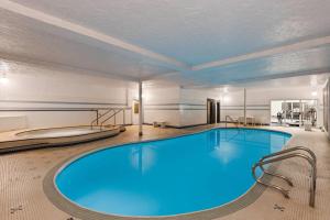 a large swimming pool in a hotel room at Royal Scot Hotel & Suites, Trademark Collection by Wyndham in Victoria