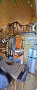 a dining table and chairs in a tiny house at Cottage Sunset 2 in Sakhalvasho