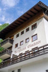 a building with a sign on the side of it at Herzerl Apartment - Heiligenblut in Heiligenblut