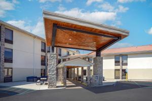 a large building with awning in front of it at Comfort Inn West Hazleton in West Hazleton