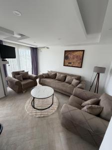 a living room with a couch and a table at Nana Dea 2 in Utjeha