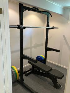 a gym with a squat rack and balls at Bergnäset in Luleå