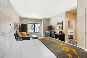 a hotel room with a bed and a desk at Cambria Hotel Copper Mountain in Frisco +65 photos