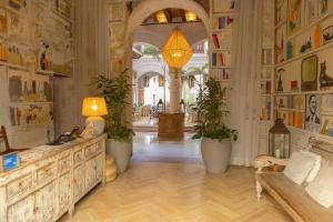 a large room with a table and some plants in it at Hotel Casa Don Luis by Faranda Boutique, a member of Radisson Individuals in Cartagena de Indias +100 photos