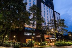 a rendering of a building at night at Faranda Collection Medellin, a Member of Radisson Individuals in Medellín