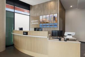 an office with a reception desk with a computer on it at Hampton Inn Long Island City NY in Long Island City