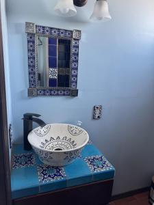 a bathroom with a sink and a mirror at Campo Rivera Beach Community in La Misión +18 photos