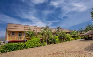 a building with a brick road in front of it at Hôtel Saint Jean Leopold in Kigali