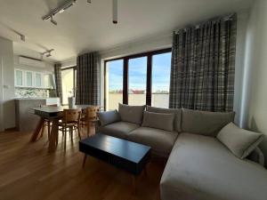 a living room with a couch and a table at Grunwaldzka 62 in Bydgoszcz