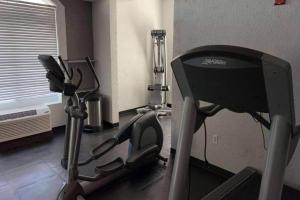 a room with a gym with a treadmill at Hotel Flamingo Inn & Suites Vero Beach I-95 in Vero Beach