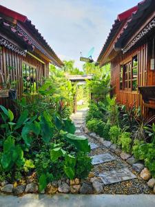 a garden with a walkway in front of a building at UR The Private Huahin in Hua Hin