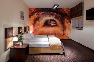 Säng eller sängar i ett rum på Boutique Hotel's Bytom