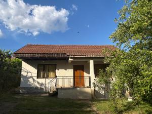 a small white house with a red roof at EmiliJana House in Dolna Matka