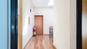 an empty room with a hallway with a door at Levico Old Town Loft in Levico Terme