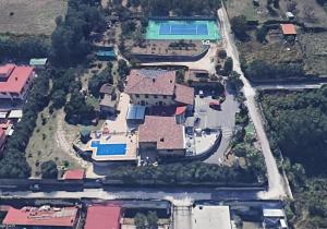 an aerial view of a house with a swimming pool at B&B Pozzuoli - Suite Ermosa in Pozzuoli