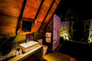a bathroom with a sink and a toilet at Taro River Resort Negombo in Otarawadiya